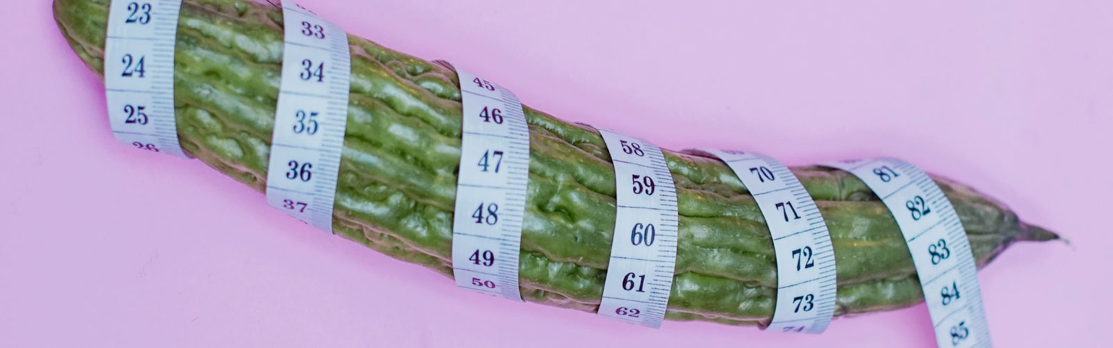 Tape measure wrapped around cucumber