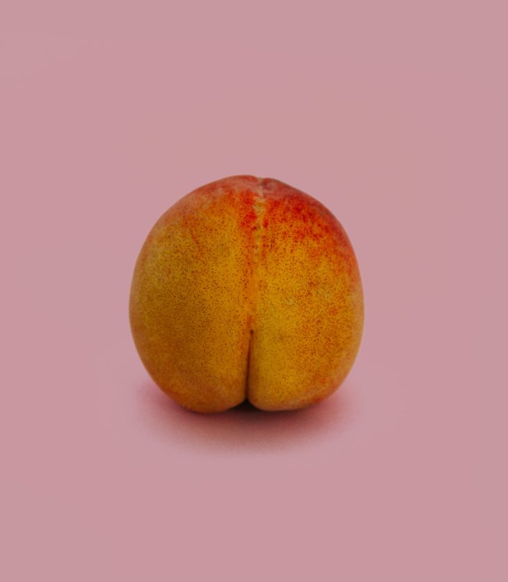 Peach on a pink background