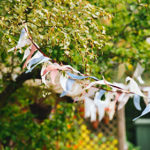 Colourful bunting flutters in a backyard breeze