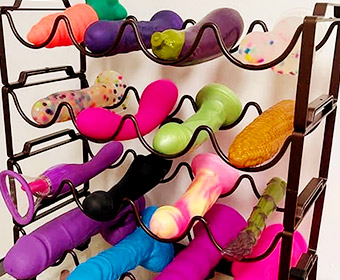 Various sex toys in a wine rack